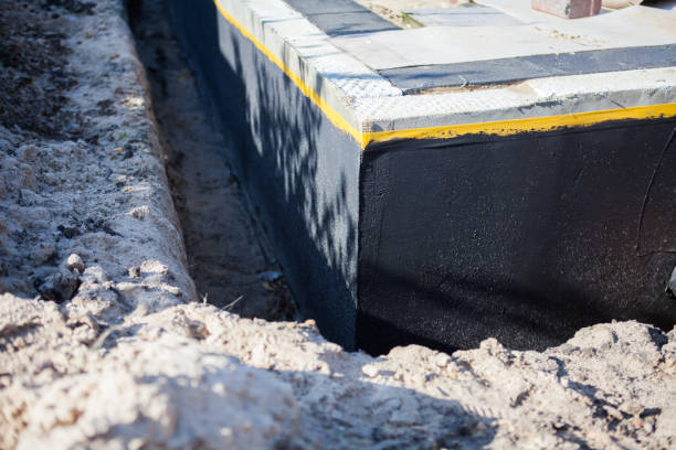 Professional Waterproofing technician working in Buckner, KY